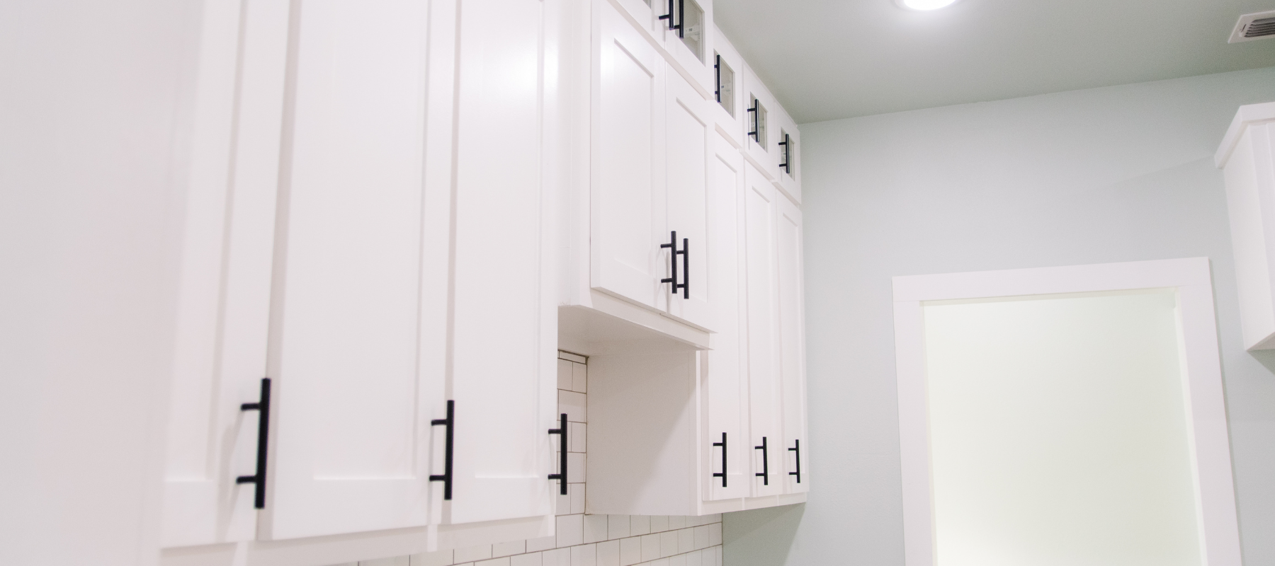 White cabinets with black hardware