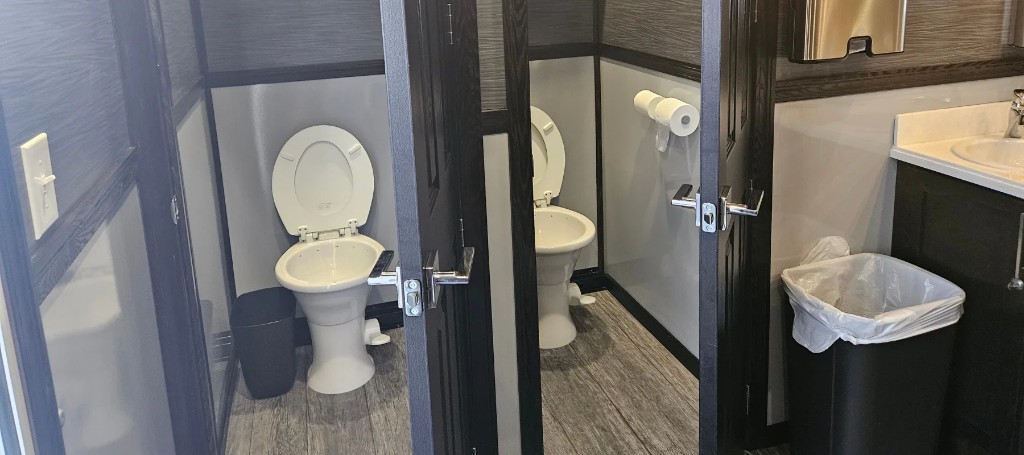 Portable toilet and luxury restroom rental units staged for events in Williamsport, PA.
